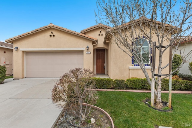 mediterranean / spanish house with driveway, a tiled roof, an attached garage, a front lawn, and stucco siding