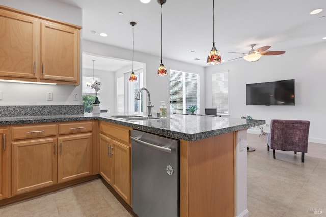 kitchen with pendant lighting, stainless steel dishwasher, a sink, dark stone counters, and a peninsula