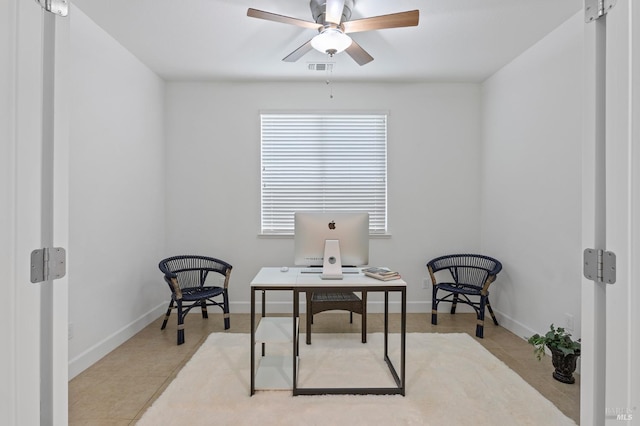 office featuring ceiling fan, baseboards, and tile patterned floors