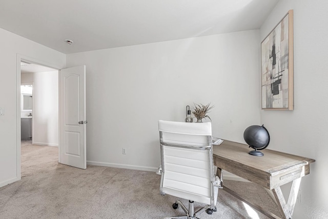 carpeted office with baseboards