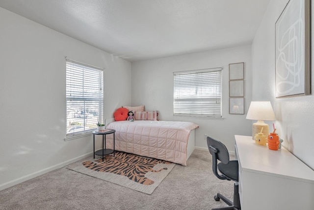 carpeted bedroom with baseboards