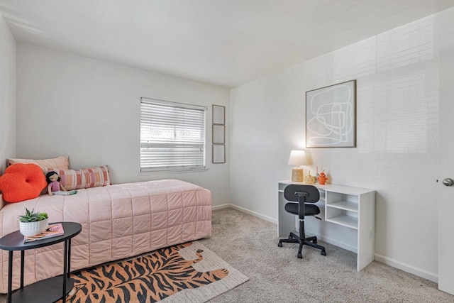 carpeted bedroom featuring baseboards