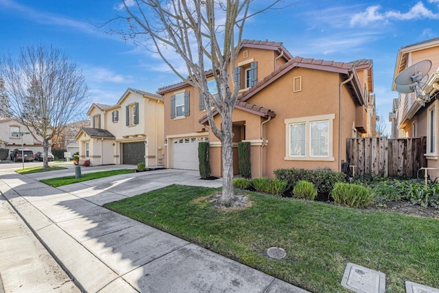 view of property with stucco siding, a residential view, concrete driveway, and fence