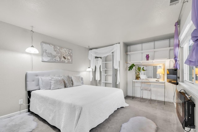 bedroom with visible vents and baseboards