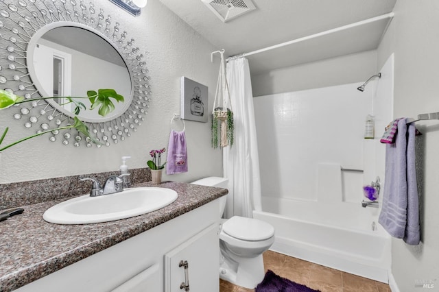 full bath with visible vents, vanity, toilet, and shower / tub combo