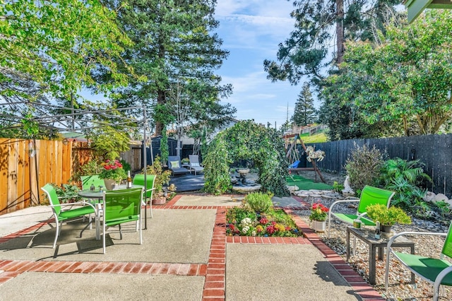 view of patio / terrace featuring outdoor dining space and a fenced backyard