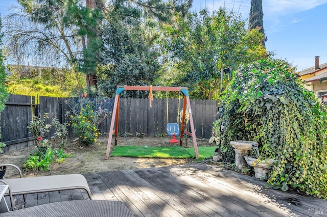 deck with a fenced backyard