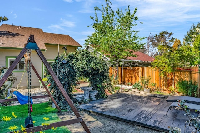 exterior space featuring a deck and fence