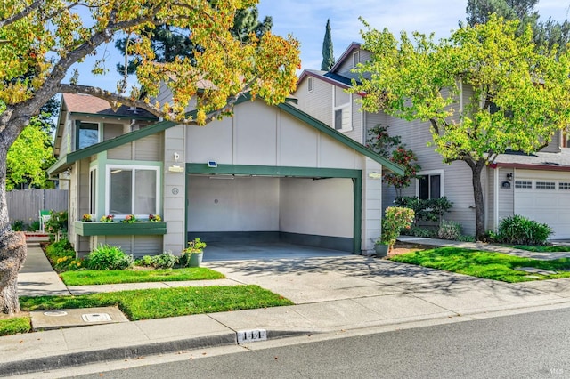 view of front facade featuring an attached garage and concrete driveway