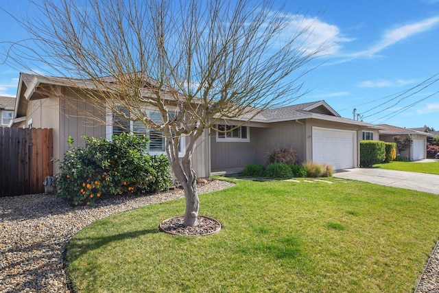 single story home featuring a garage, fence, a front lawn, and concrete driveway