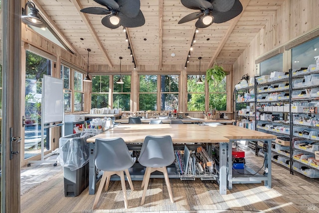 interior space featuring vaulted ceiling with beams, brick floor, wooden ceiling, and a ceiling fan