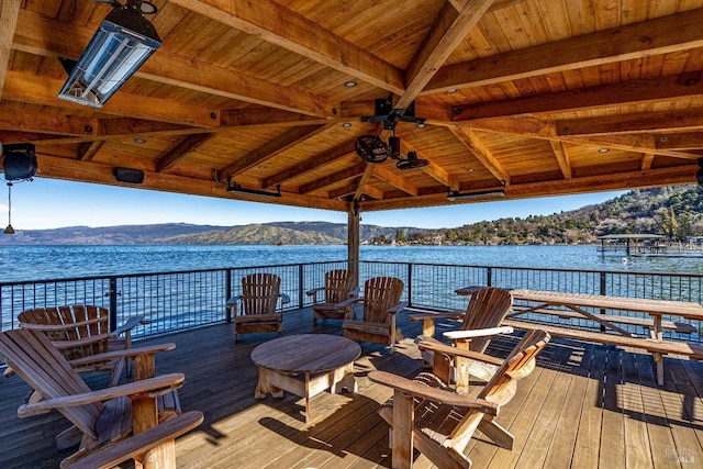 deck featuring a water and mountain view