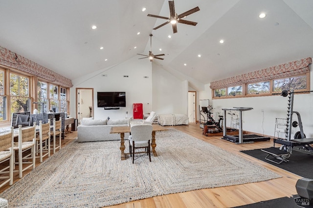 living area featuring ceiling fan, high vaulted ceiling, wood finished floors, and recessed lighting