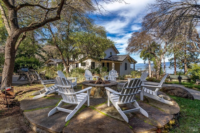 view of patio / terrace with a fire pit