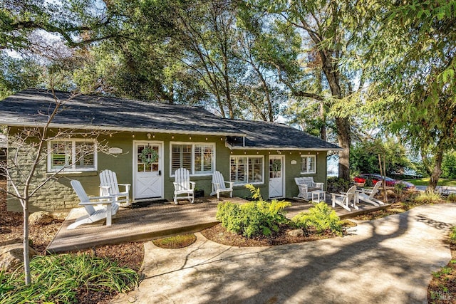 view of front of home featuring a patio and stucco siding