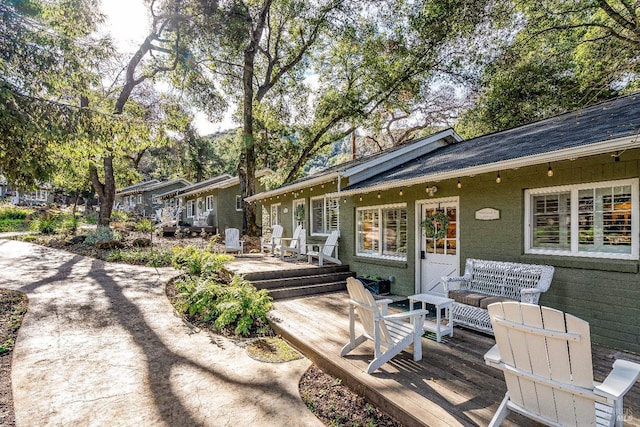 rear view of property with a deck