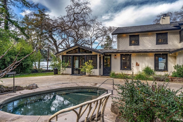 outdoor pool featuring a patio