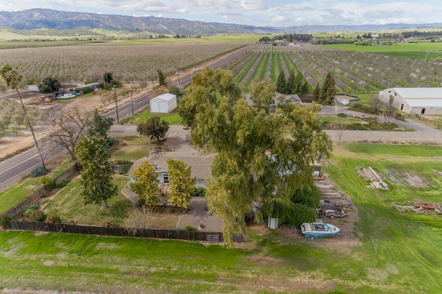 drone / aerial view featuring a rural view and a mountain view