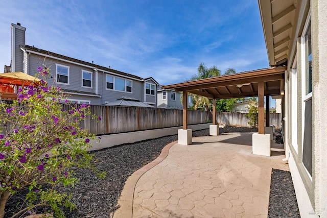 view of yard with a fenced backyard and a patio