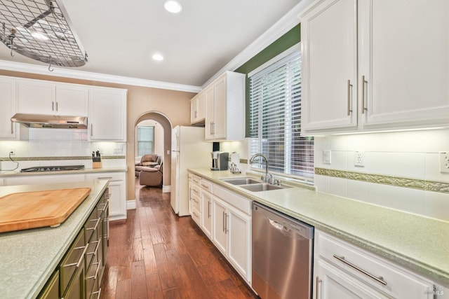 kitchen with arched walkways, stainless steel dishwasher, crown molding, under cabinet range hood, and a sink