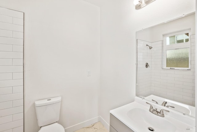 full bathroom with toilet, vanity, baseboards, marble finish floor, and walk in shower