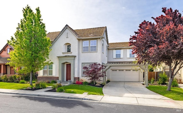 view of front facade featuring a garage, fence, concrete driveway, stucco siding, and a front lawn
