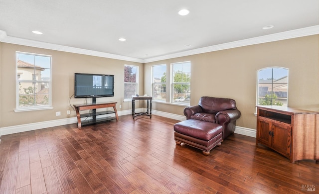 sitting room featuring ornamental molding, recessed lighting, dark wood finished floors, and baseboards