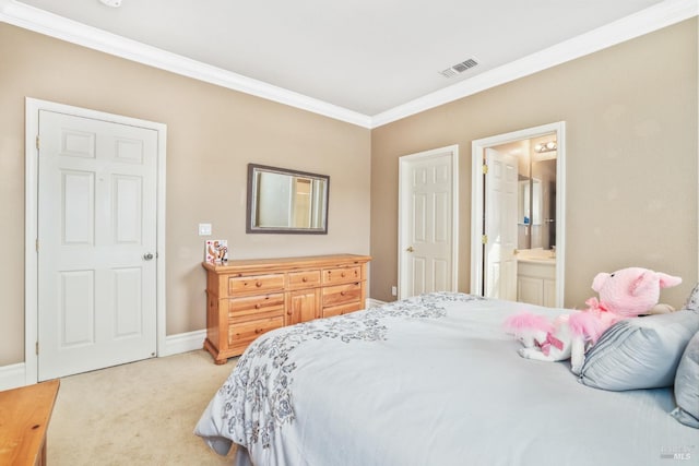 bedroom featuring ensuite bathroom, light colored carpet, visible vents, baseboards, and crown molding