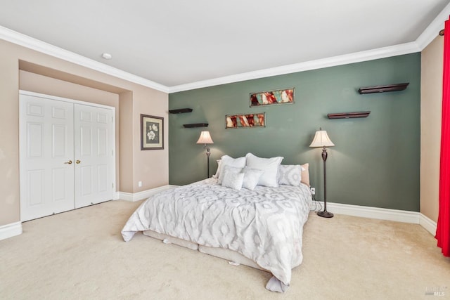 bedroom with ornamental molding, carpet, and baseboards