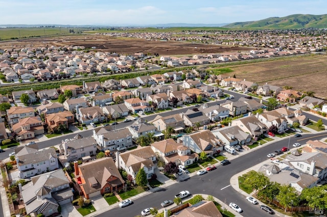 drone / aerial view with a mountain view and a residential view