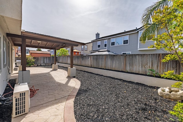 view of yard with a fenced backyard and a patio