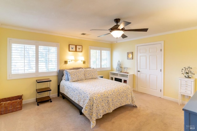 bedroom with light carpet, ornamental molding, visible vents, and baseboards