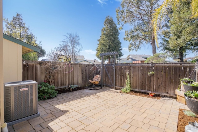 view of patio featuring a fenced backyard and cooling unit