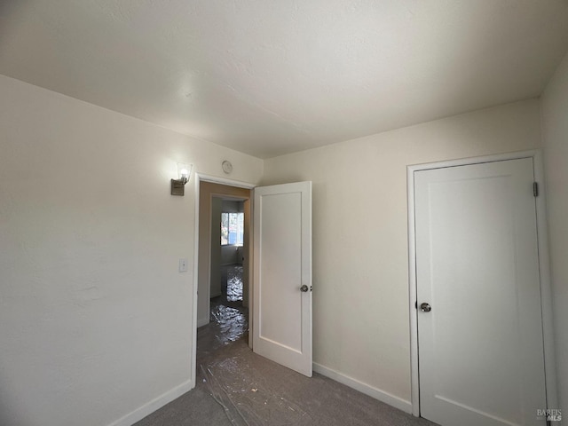 unfurnished bedroom featuring baseboards