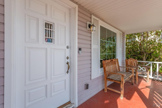 doorway to property featuring a porch