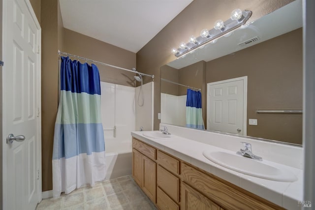 bathroom featuring double vanity, shower / bathtub combination with curtain, visible vents, and a sink