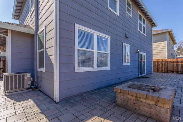 exterior space with a patio, fence, and central air condition unit