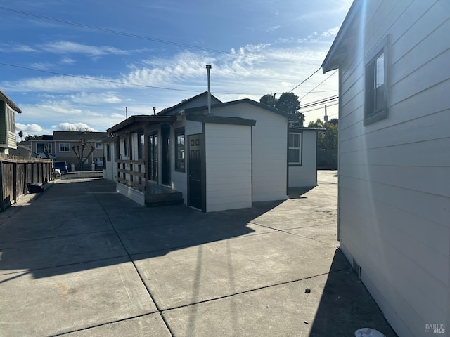 view of property exterior with fence