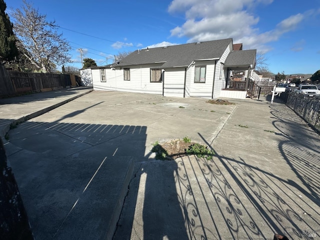 back of house with a patio and a fenced backyard