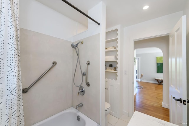 full bath with toilet, recessed lighting, wood finished floors, baseboards, and shower / bathtub combination with curtain