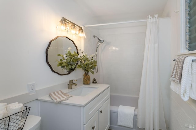 bathroom with shower / bath combo, vanity, and toilet