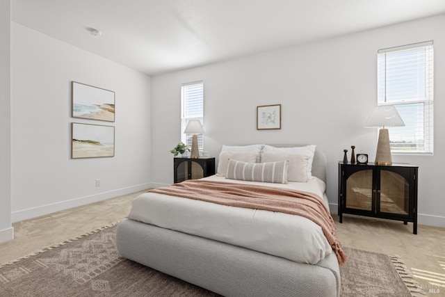 bedroom with baseboards and carpet flooring