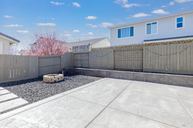 view of patio / terrace featuring a fire pit and a fenced backyard