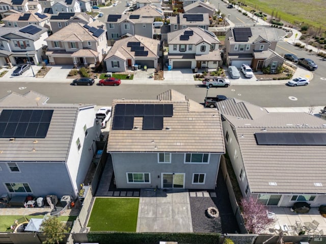 birds eye view of property with a residential view