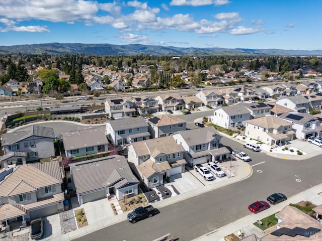 birds eye view of property with a residential view and a mountain view