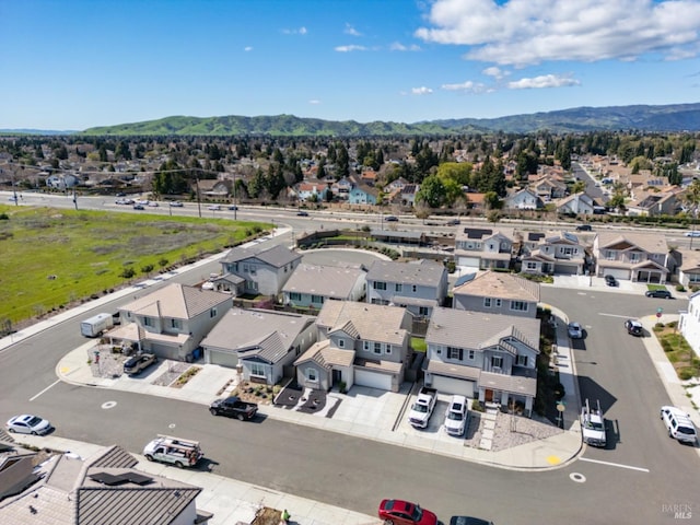 drone / aerial view with a residential view and a mountain view