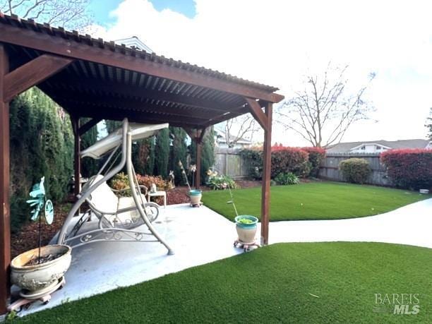 view of patio / terrace with a fenced backyard and a pergola