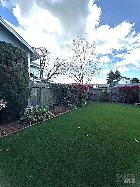 view of yard with a fenced backyard