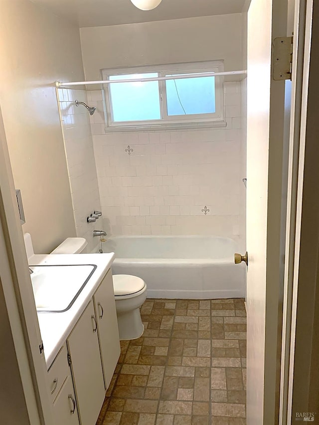 bathroom with toilet, shower / washtub combination, and vanity