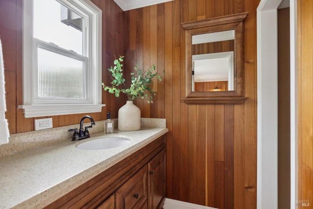 bathroom with wooden walls and vanity